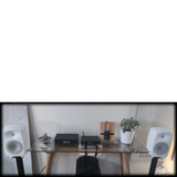 Undentia AB media converter setup with Genelec speakers and audio streaming equipment on a glass desk