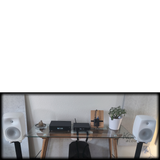 Undentia AB media converter setup with Genelec speakers and audio streaming equipment on a glass desk