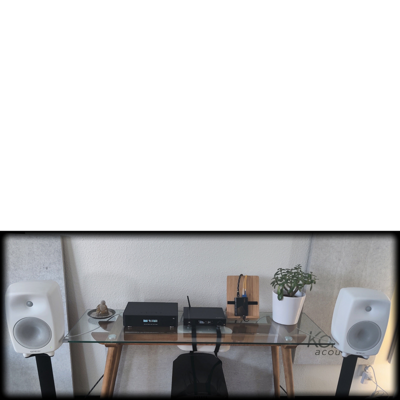 Undentia AB media converter setup with Genelec speakers and audio streaming equipment on a glass desk