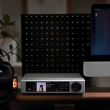 Undentia AB Element i2 silver music streamer with LCD touchscreen and headphone jack on a wooden desk