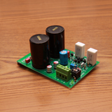 Undentia AB linear power supply circuit board with large capacitors and electronic components on a wooden surface