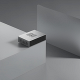 Undentia AB Matrix Audio TT-1 digital transport in a sleek silver metal finish, positioned on a minimalist grey block.