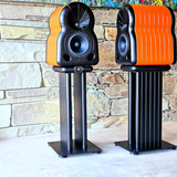 Undentia AB MaYa II high-end studio monitor speakers in vibrant orange and black on matching black floor stands.
