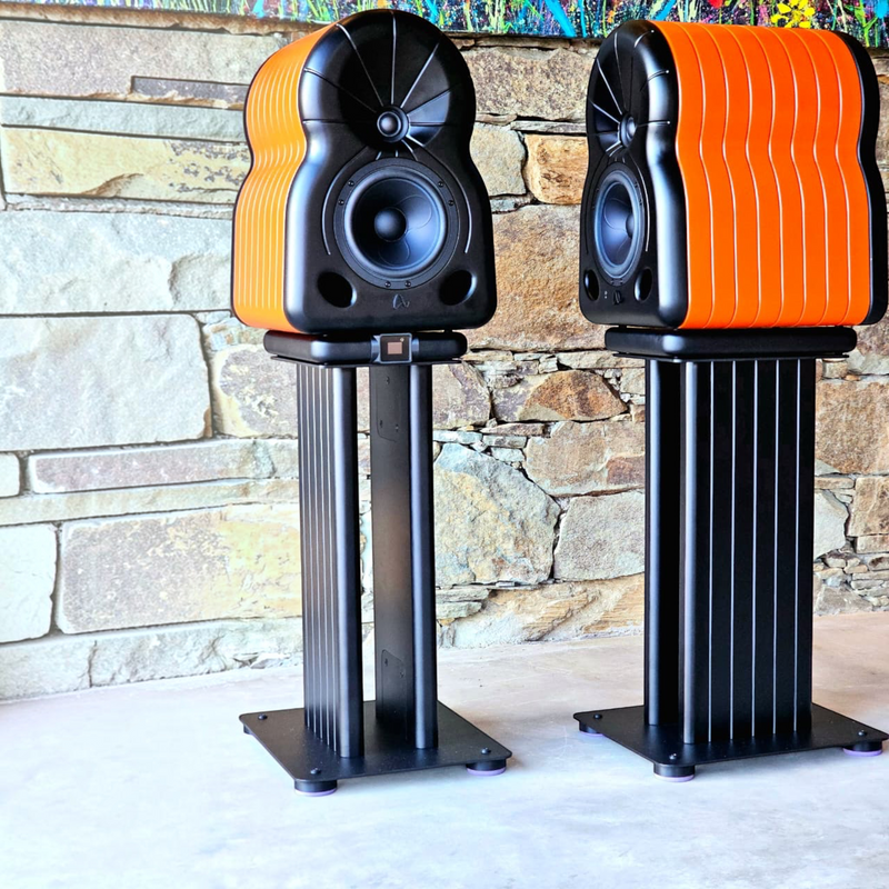 Undentia AB MaYa II high-end studio monitor speakers in vibrant orange and black on matching black floor stands.