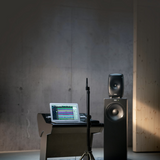Undentia AB Genelec W371A SAM woofer system paired with a studio monitor in a professional recording studio setup