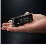 Undentia AB compact black micro media converter held in a palm for scale, featuring SFP module slot