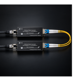 Undentia AB micro media converters with yellow fiber optic cables connected against a black background