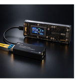 Undentia AB Micro Media Converter connected to a portable power bank via USB cable on a black background