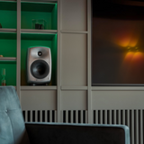 Undentia AB G Two compact active speaker in silver finish placed on a shelf in a modern living room interior