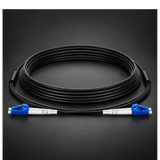 Undentia AB armored single mode duplex fiber optic cable with blue connectors coiled on a dark background