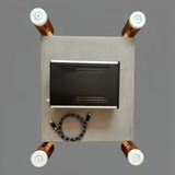 Undentia AB Fiberbox II optical network isolator and reclocker in black and silver, viewed from above with cable.