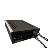 Undentia AB Fiberbox II optical network isolator and reclocker with connected LAN cables on a black background.