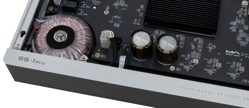 Undentia AB Matrix Audio SS-1 Pro network switch internal view showing toroidal transformer and audio-grade capacitors