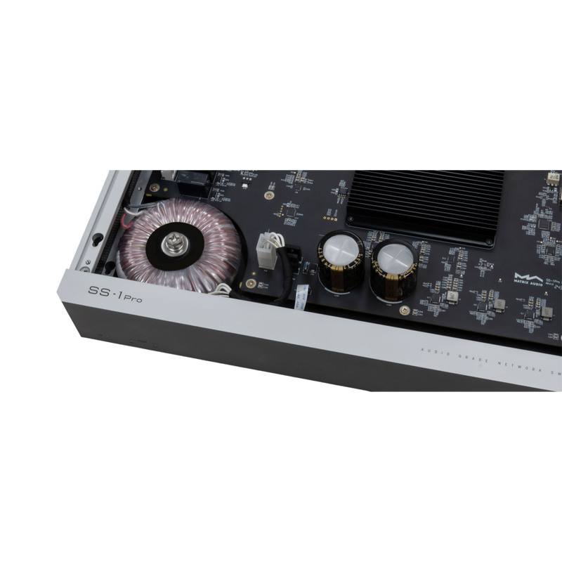 Undentia AB Matrix Audio SS-1 Pro network switch internal view showing toroidal transformer and audio-grade capacitors